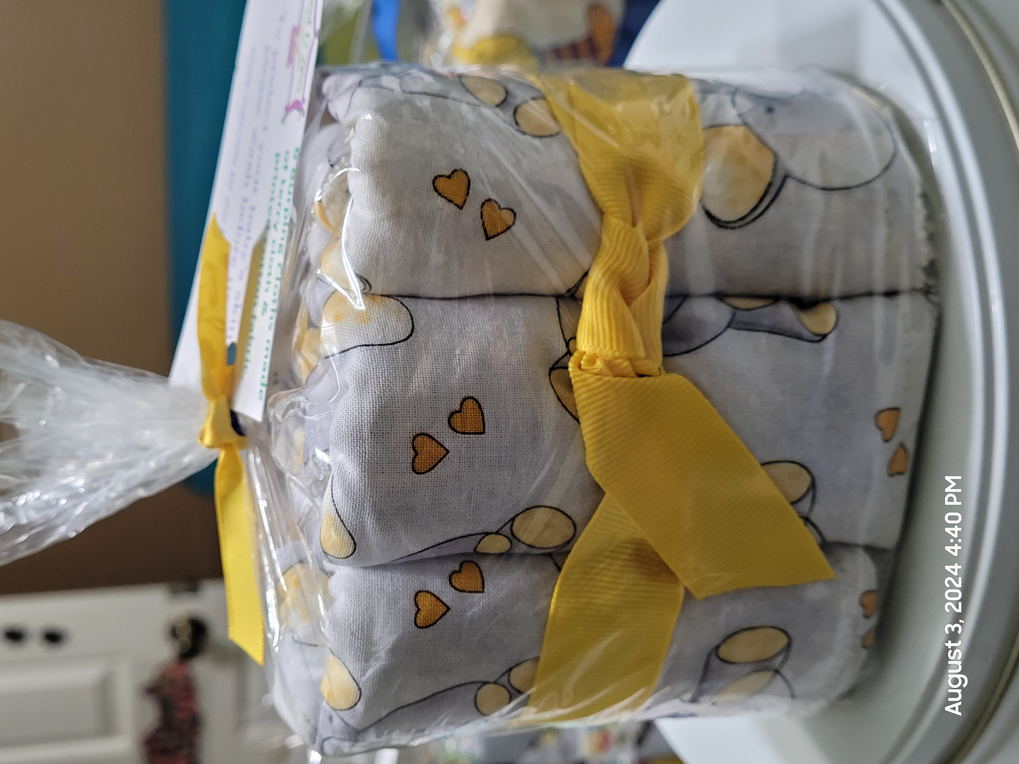 Yellow themed baby gift set with bow