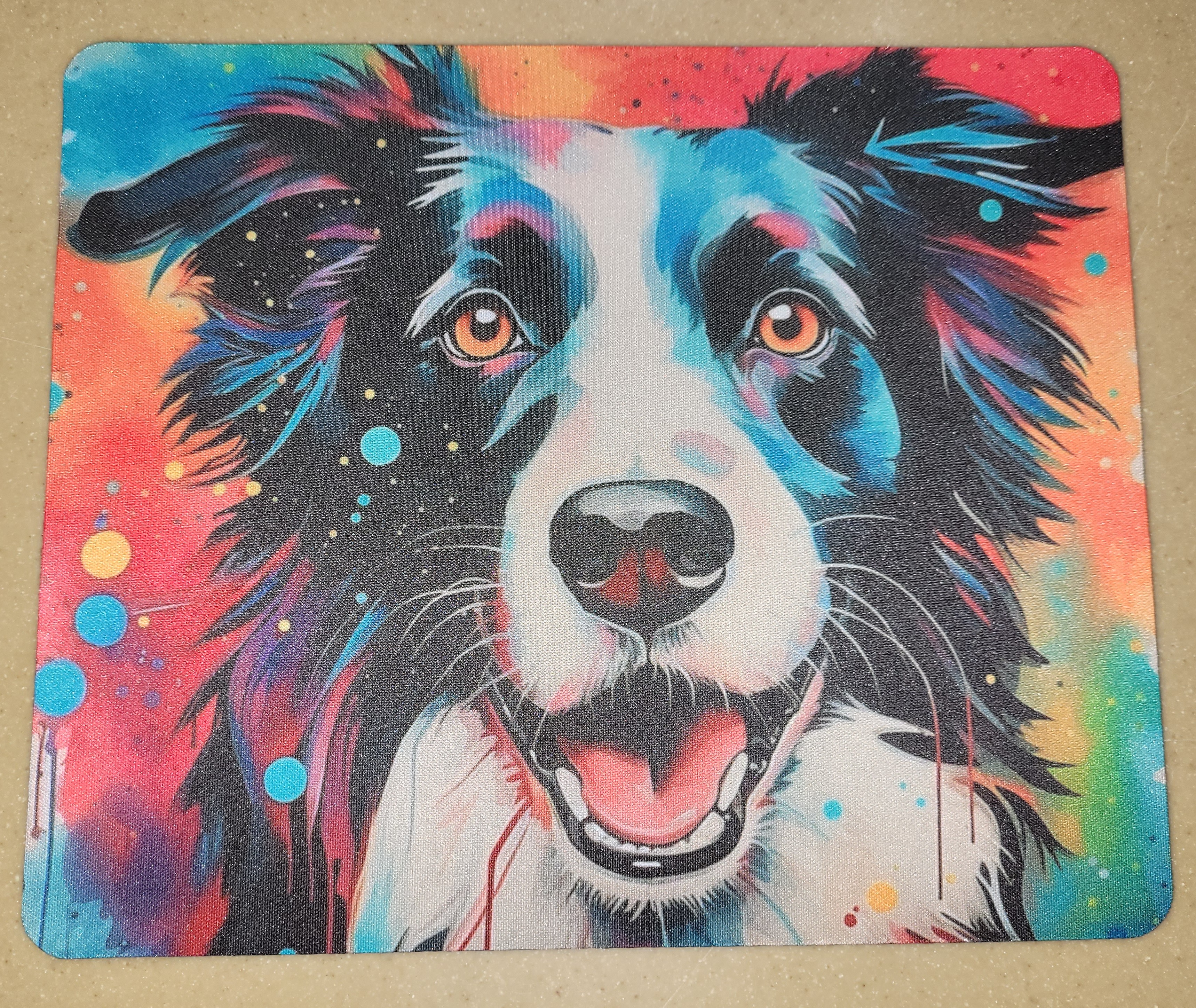 Mouse pad featuring a colorful painted dog