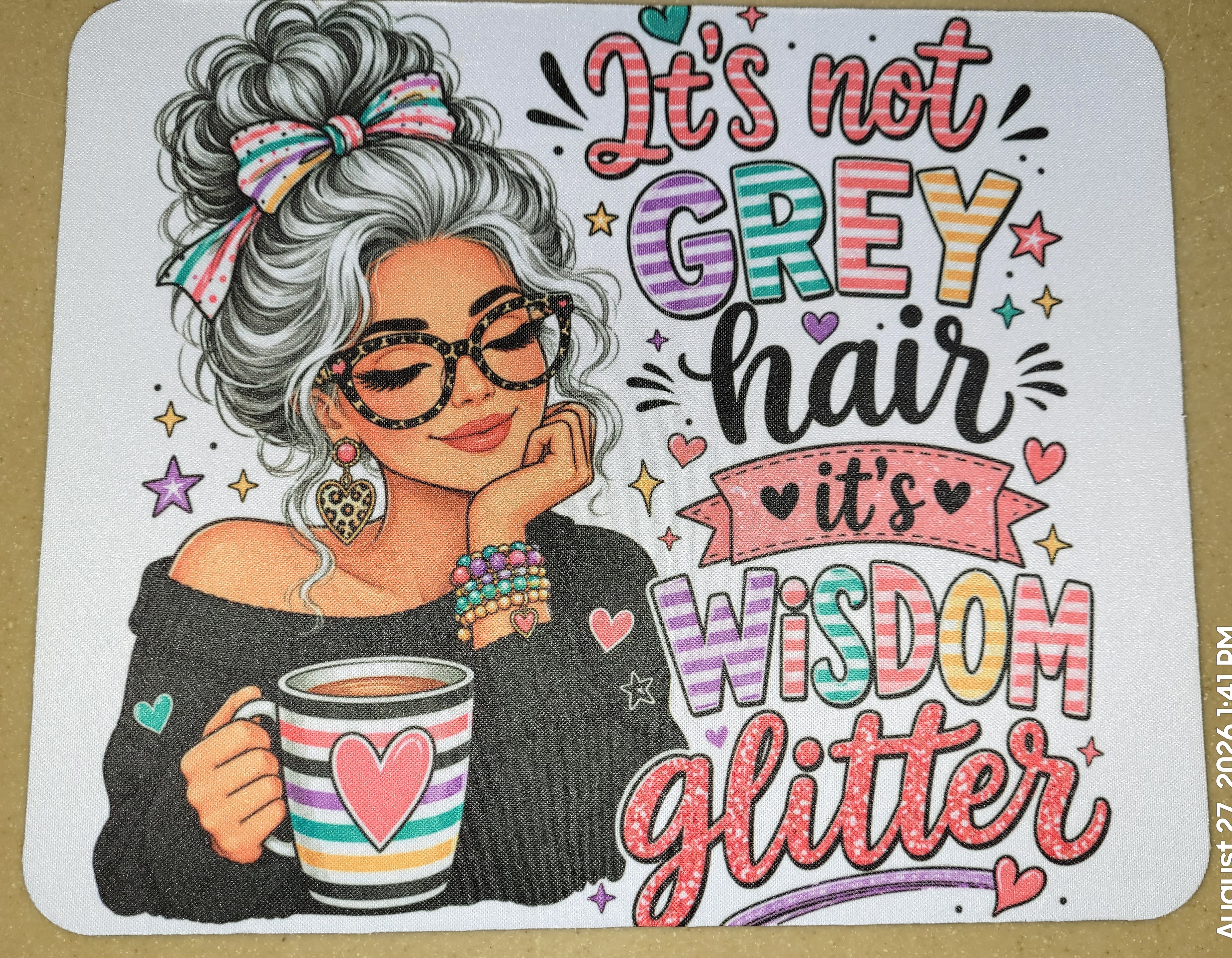 Mouse pad reading It's not grey hair, it's wisdom glitter